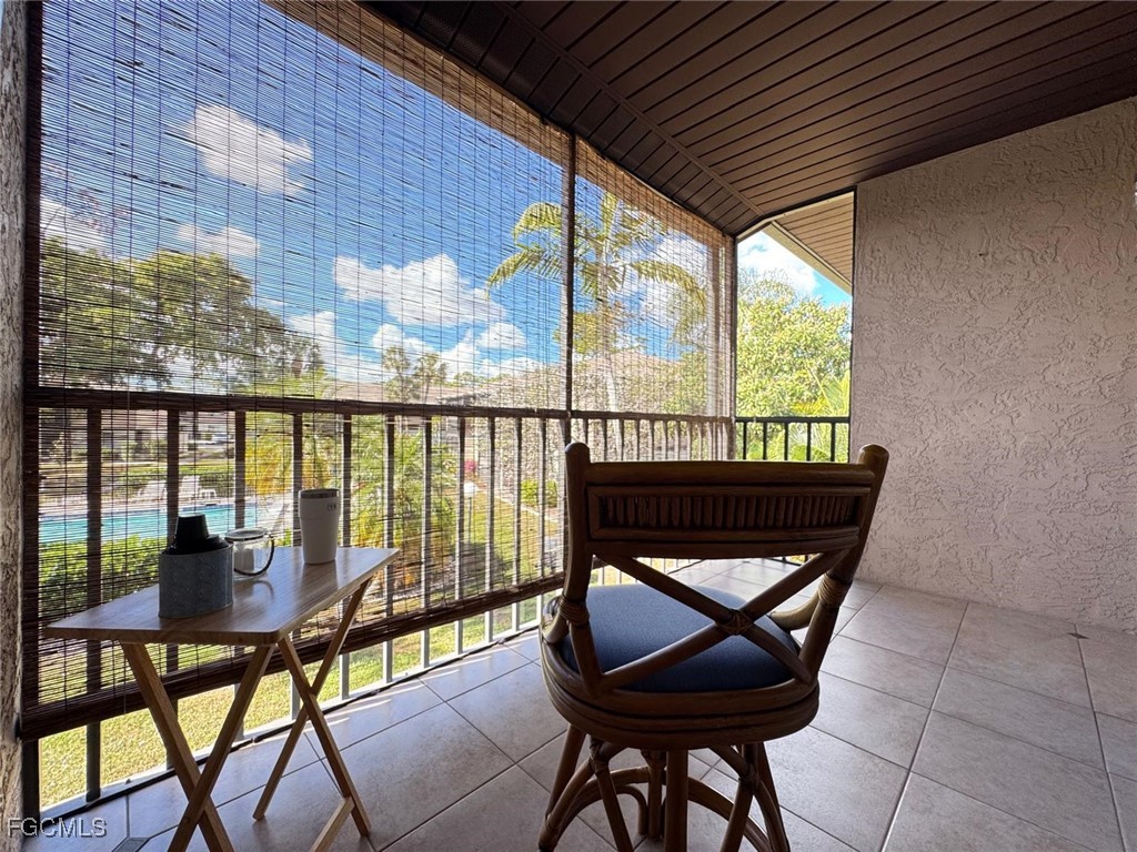 1211 Barrett Road, Unit 1106 North Fort Myers, FL 33903 - Photo 27 of 28 a living room with a table and chairs