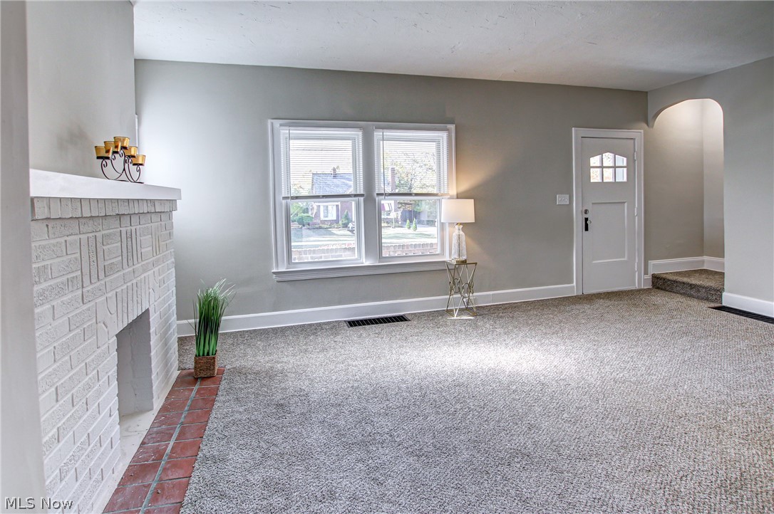 905 Woodview Road Cleveland, OH 44121 - Photo 9 of 32 living room with fire place