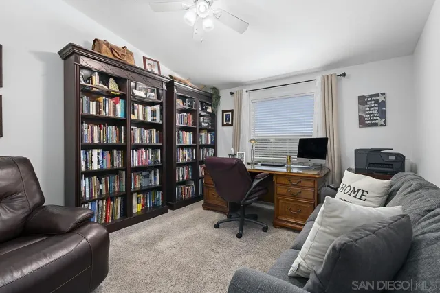 a bedroom with a bed and a chair