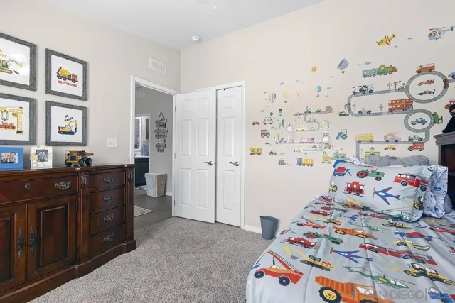 a bedroom with a workspace