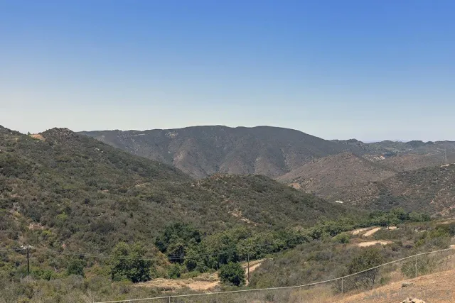 a view of a town with mountains in the background