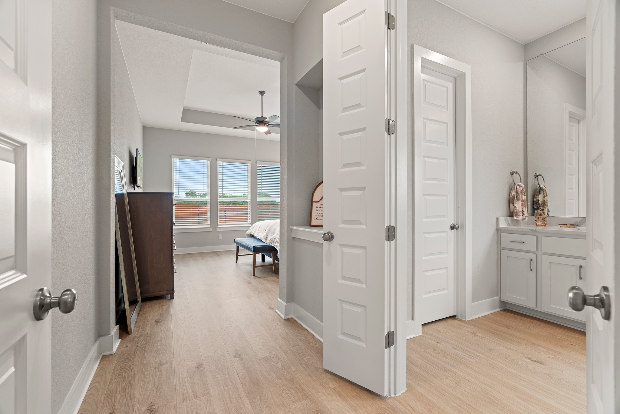 2112 Tobiano Trace Georgetown, TX 78633 - Photo 14 of 40 Corridor with light wood finished floors and baseboards