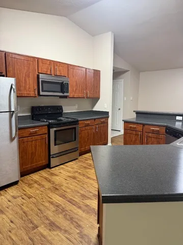 a view of kitchen and wooden floor