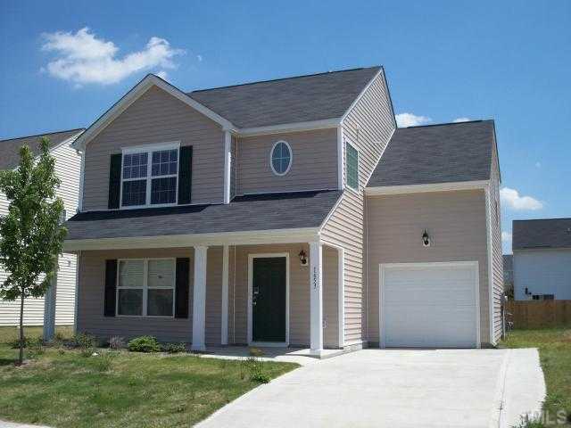 1653 Extine Lane Raleigh, NC 27610 - Photo 1 of 4 a front view of a house with garden