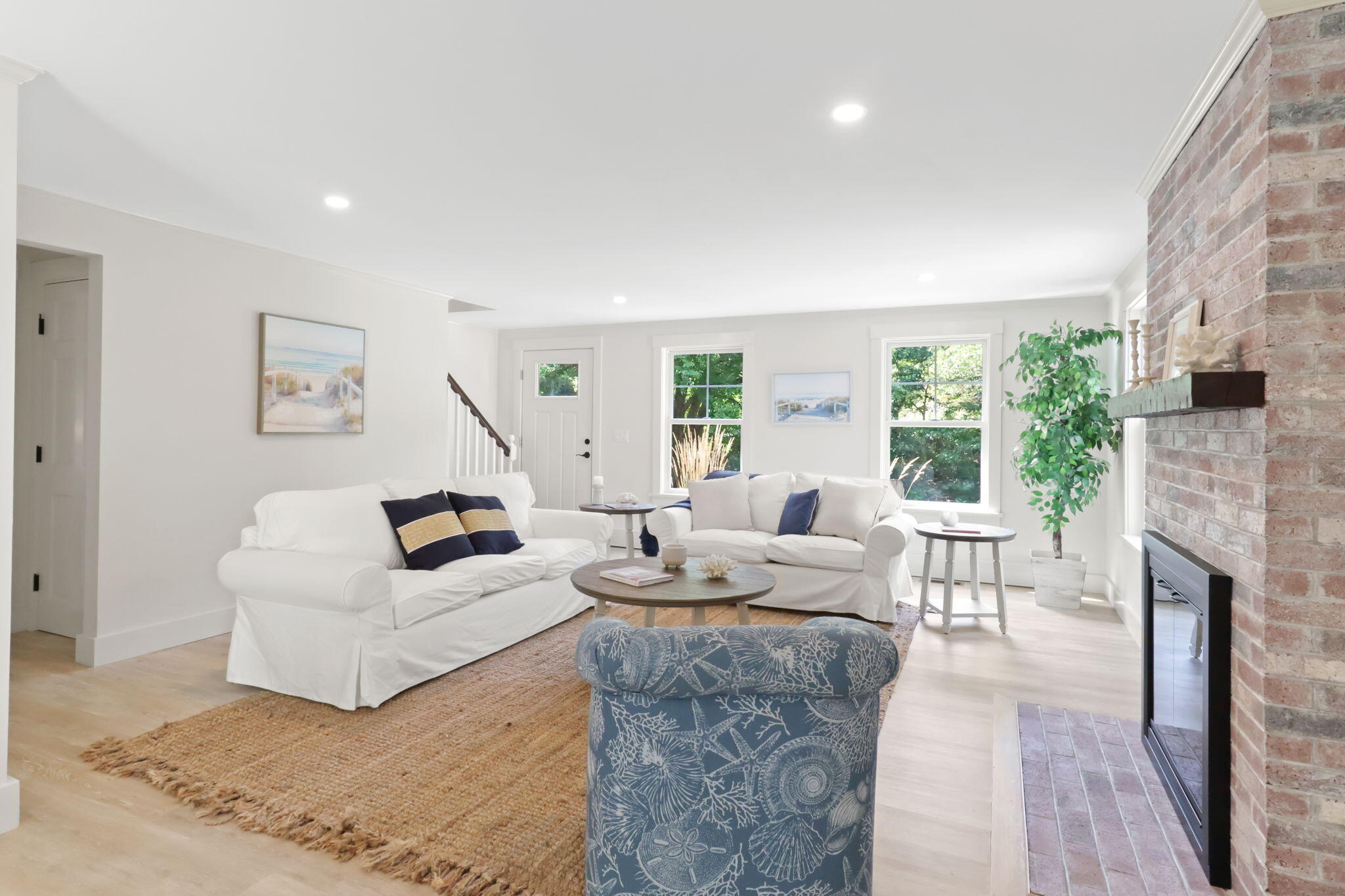 193 Northgate Road Chatham, MA 02633 - Photo 13 of 72 a living room with furniture a large window and a fireplace