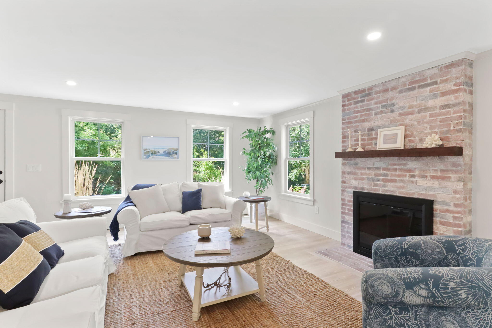 193 Northgate Road Chatham, MA 02633 - Photo 14 of 72 a living room with furniture and a fireplace