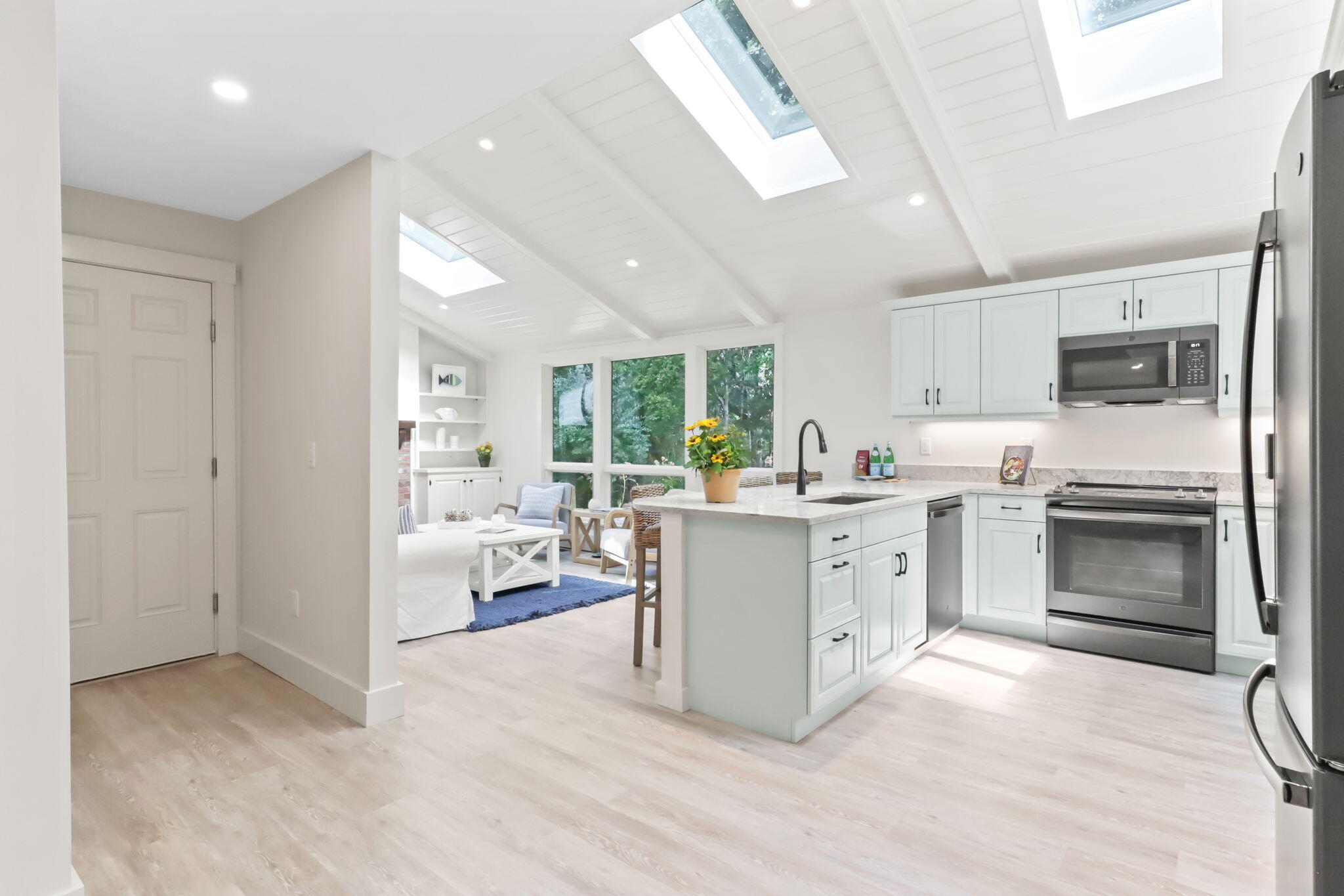 193 Northgate Road Chatham, MA 02633 - Photo 20 of 72 a kitchen with white cabinets and white appliances