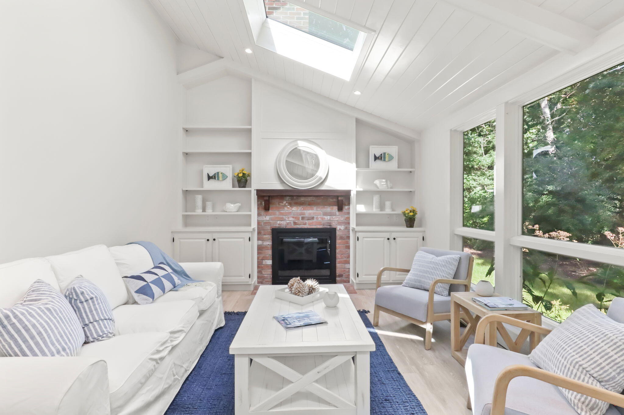 193 Northgate Road Chatham, MA 02633 - Photo 25 of 72 a living room with furniture a fireplace with a large window