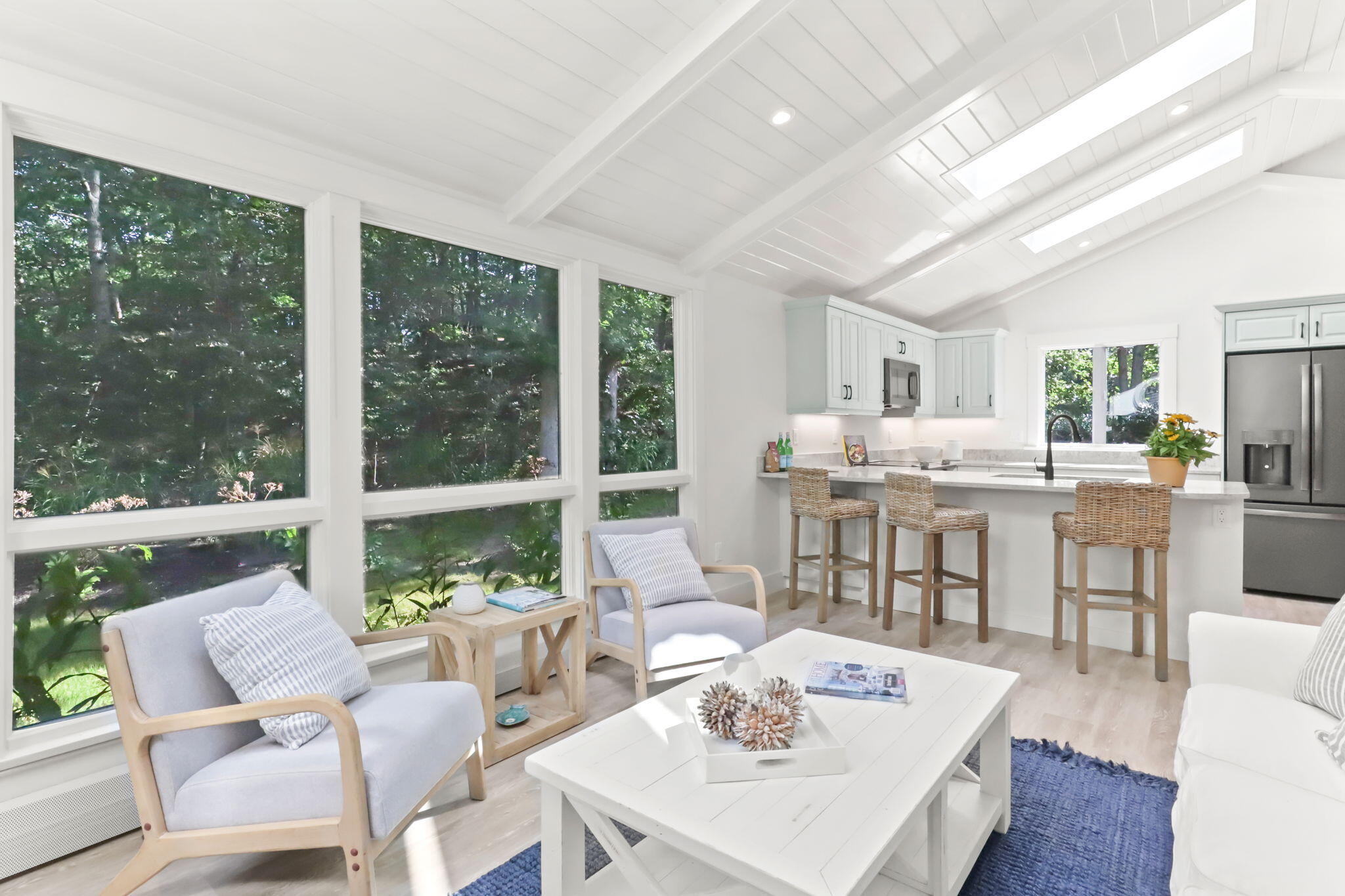 193 Northgate Road Chatham, MA 02633 - Photo 26 of 72 a living room with large windows and wooden floor