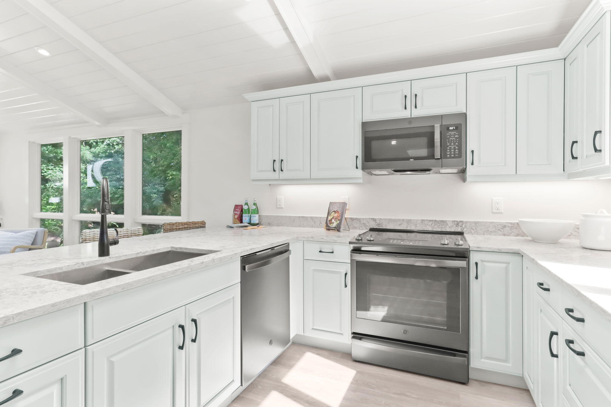 193 Northgate Road Chatham, MA 02633 - Photo 30 of 72 a kitchen with cabinets stainless steel appliances a sink and a window