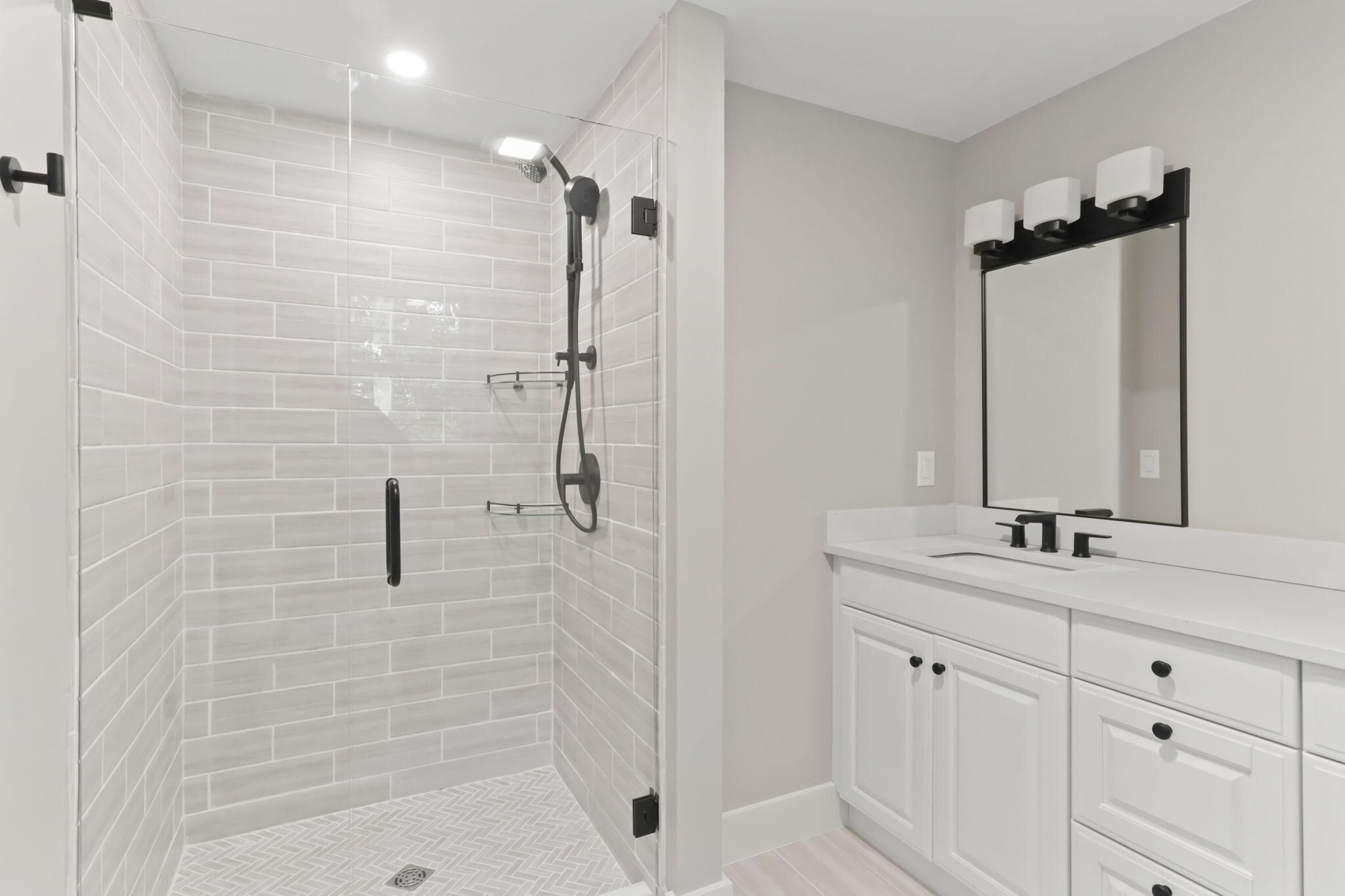 193 Northgate Road Chatham, MA 02633 - Photo 36 of 72 a bathroom with a shower sink and mirror