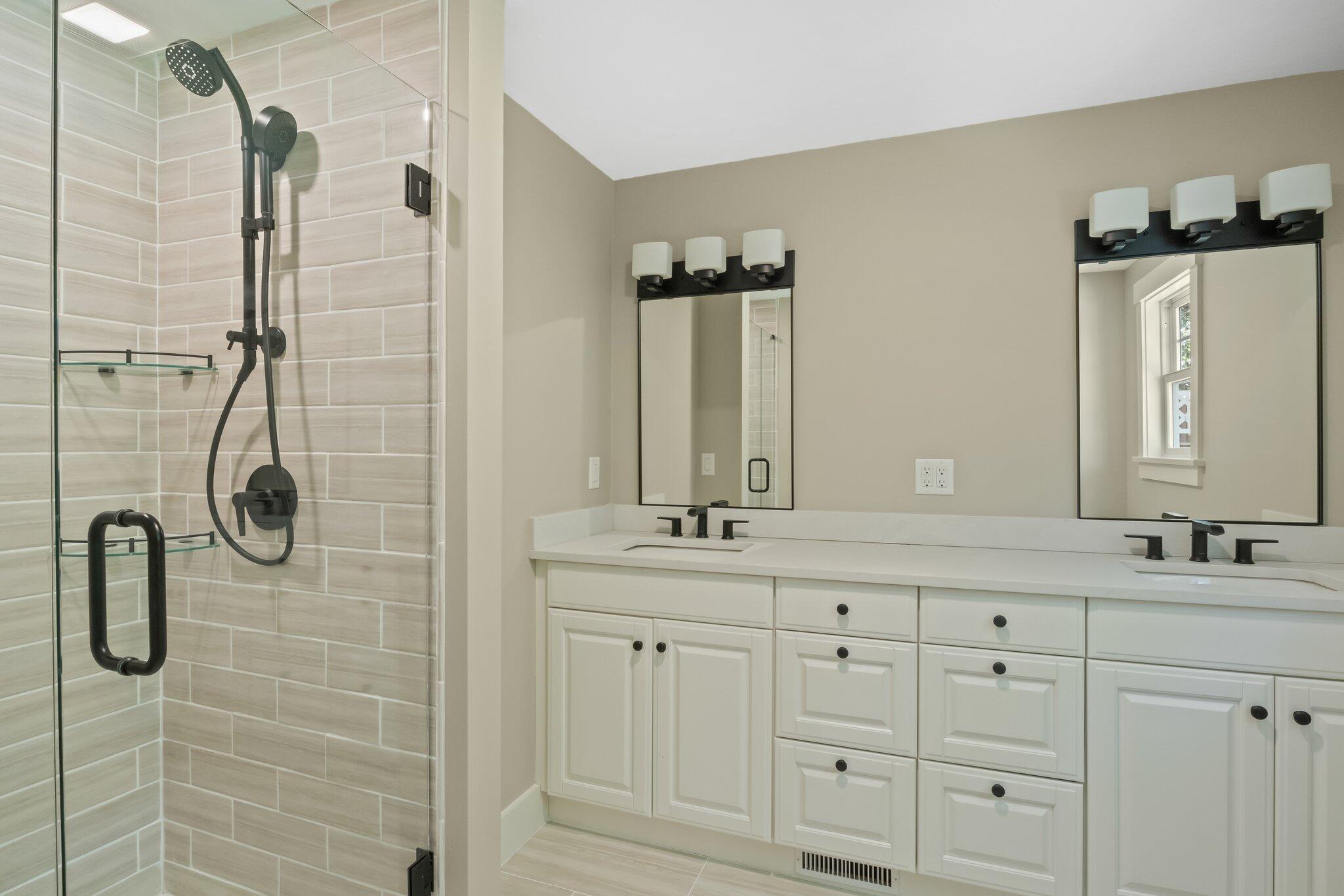 193 Northgate Road Chatham, MA 02633 - Photo 38 of 72 a bathroom with a double vanity sink a shower and a mirror