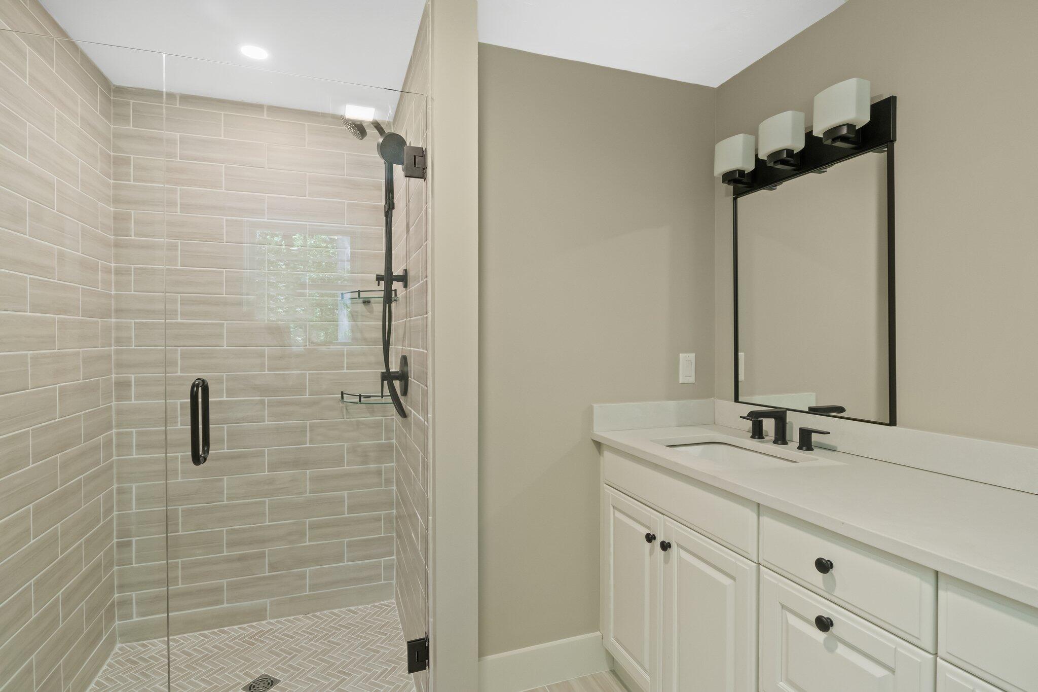 193 Northgate Road Chatham, MA 02633 - Photo 39 of 72 a bathroom with a sink and a mirror