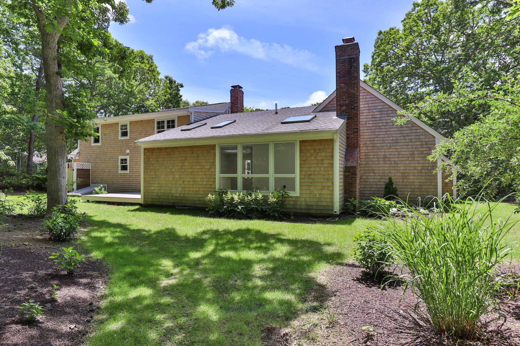 193 Northgate Road Chatham, MA 02633 - Photo 52 of 72 a front view of a house with a garden