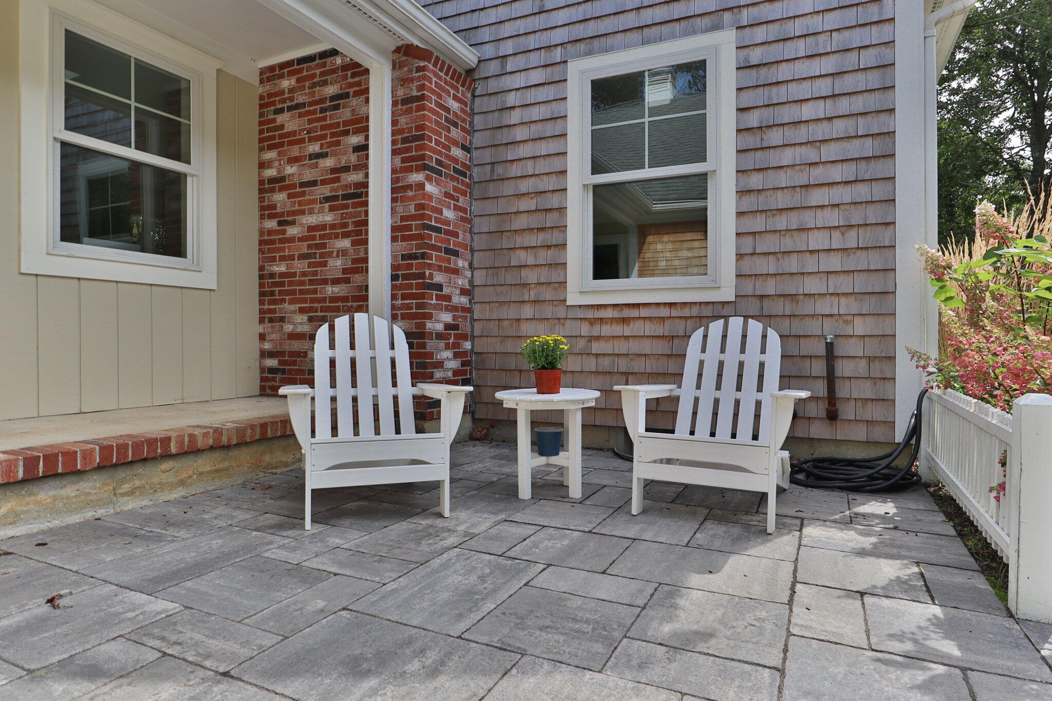 193 Northgate Road Chatham, MA 02633 - Photo 7 of 72 a view of a chair and table in the back yard of the house