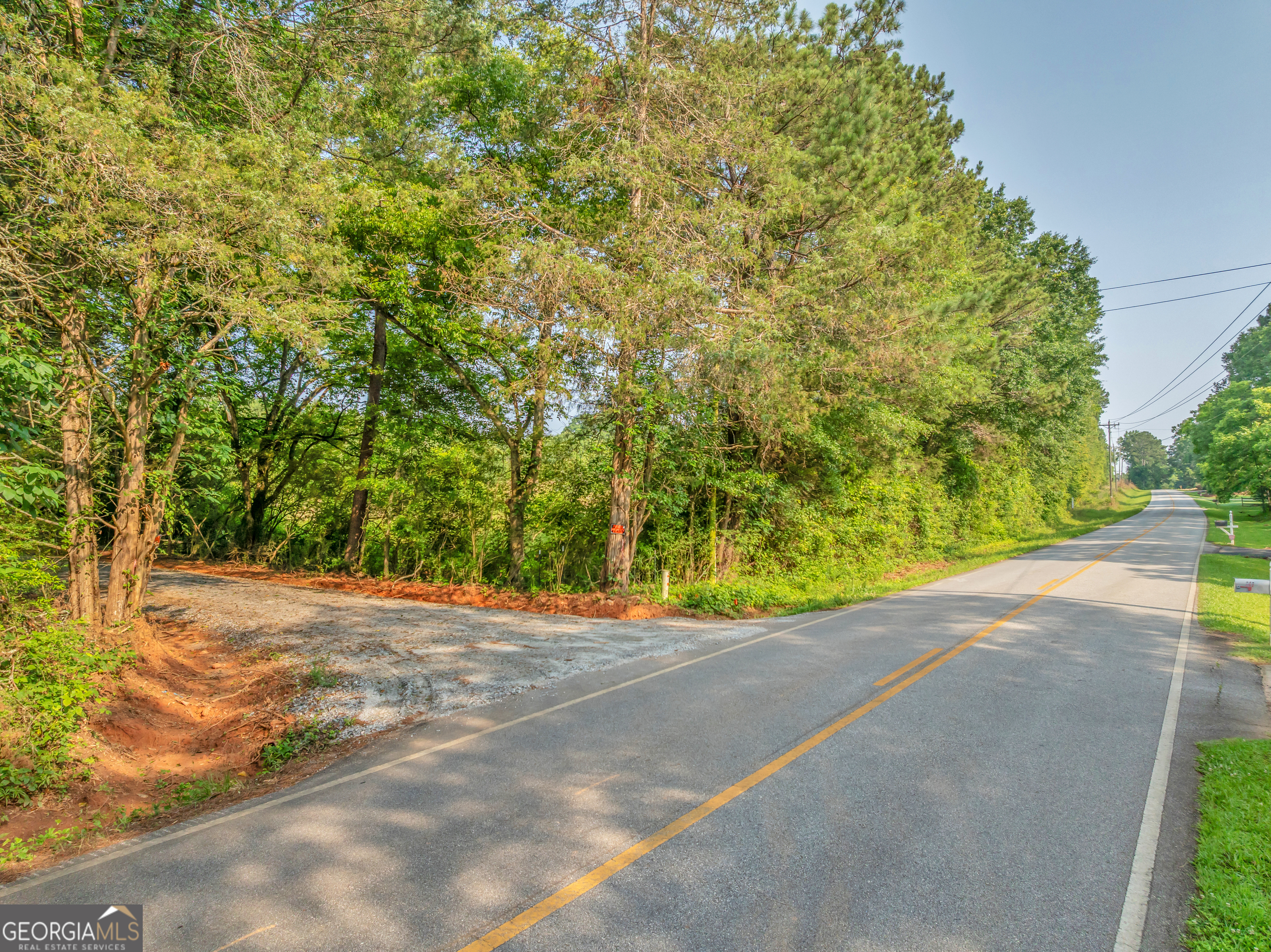 0 County Line Road Jenkinsburg, GA 30234 - Photo 20 of 24 a view of a road with a building in the background