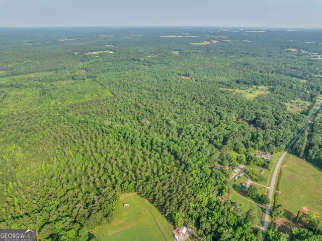 a view of a yard with an outdoor seating