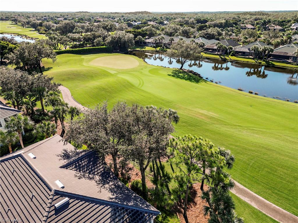 9241 Palmetto Ridge Drive, Unit 101 Estero, FL 34135 - Photo 28 of 28 a view of a swimming pool with a lake view