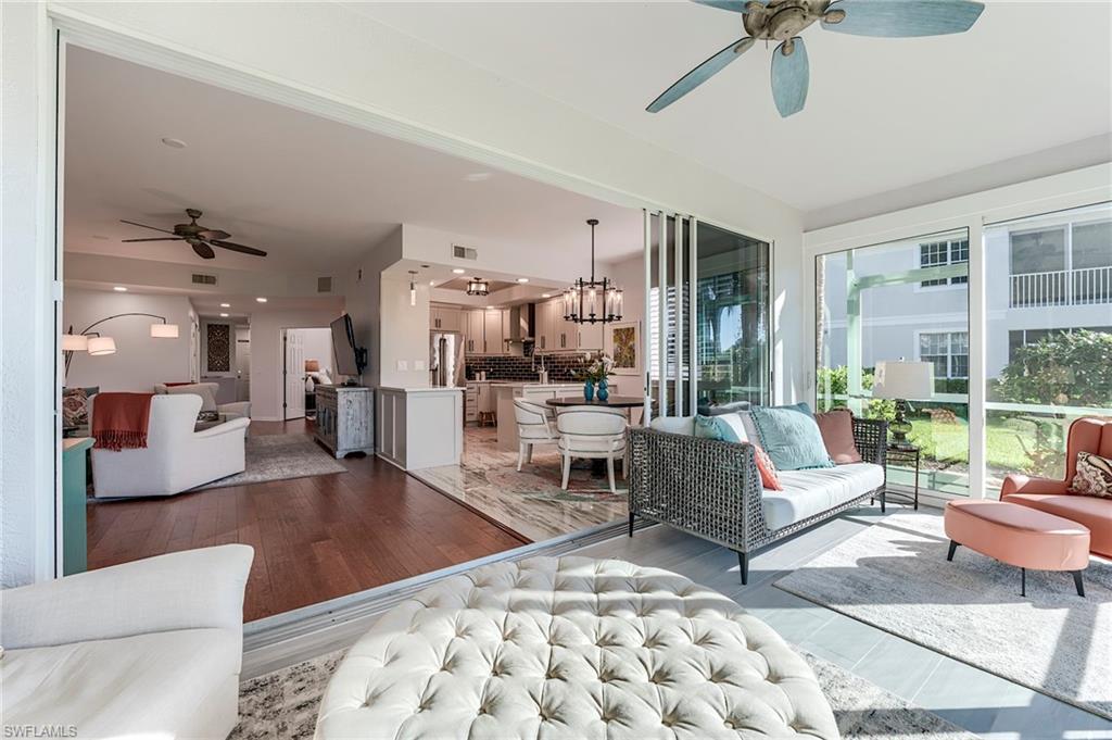 9241 Palmetto Ridge Drive, Unit 101 Estero, FL 34135 - Photo 7 of 28 a living room with furniture and a large window