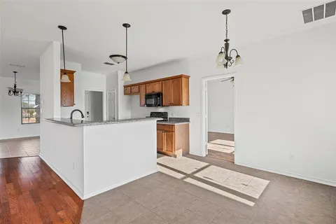a view of a kitchen with sink and dishwasher