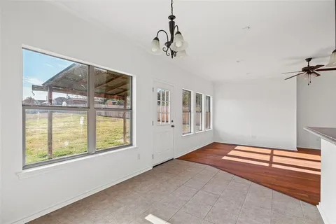 a view of livingroom with hardwood floor and ceiling fan