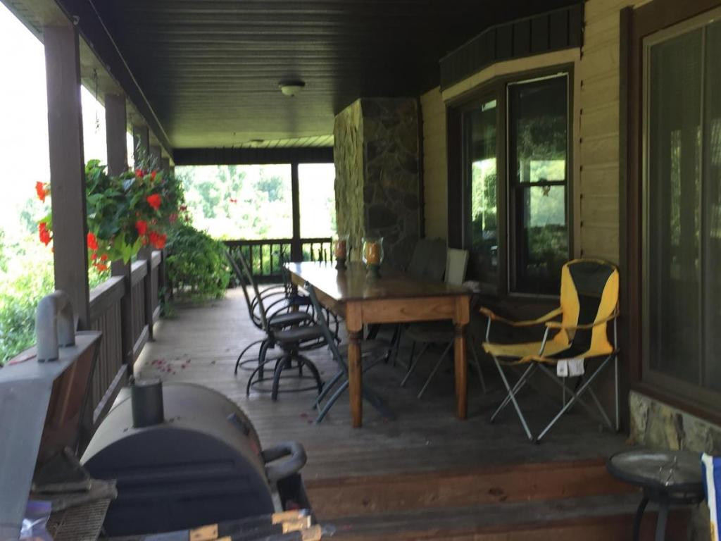 154 Clyde White Road Elizabethton, TN 37643 - Photo 3 of 18 Wrap around front porch