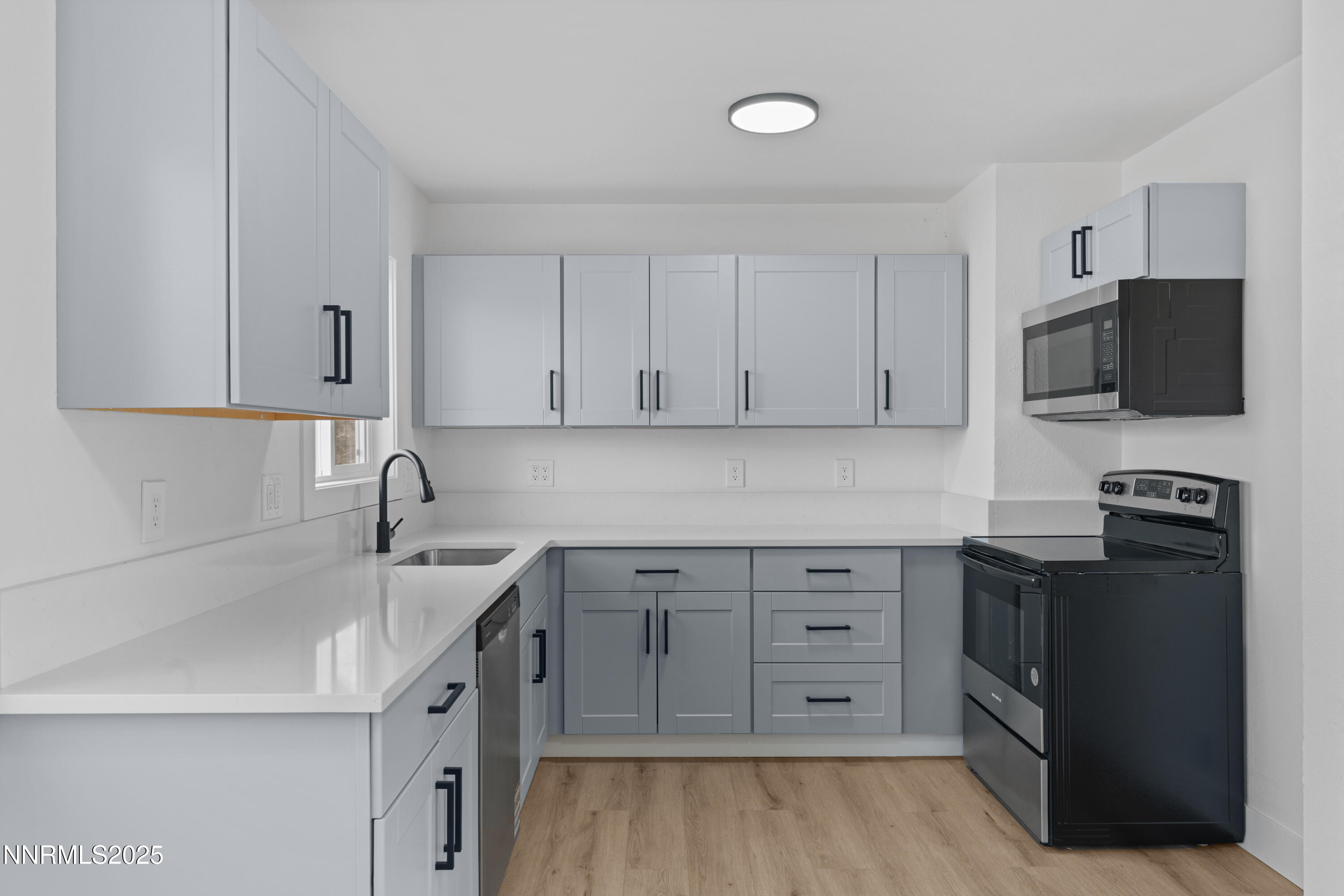 1620 Harold Drive Reno, NV 89503 - Photo 11 of 49 a kitchen with a sink stove and microwave