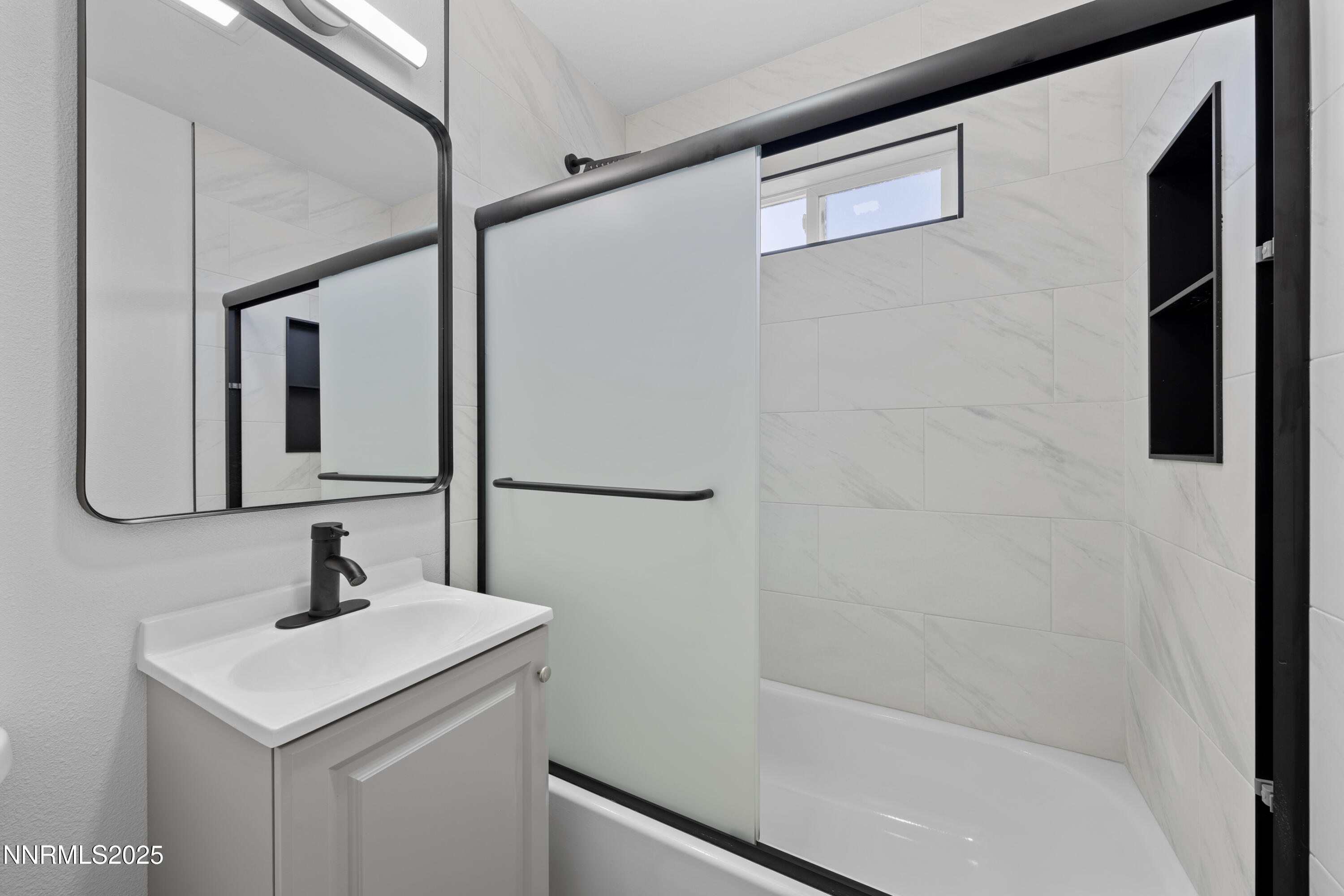 1620 Harold Drive Reno, NV 89503 - Photo 25 of 49 a bathroom with a sink a mirror and shower