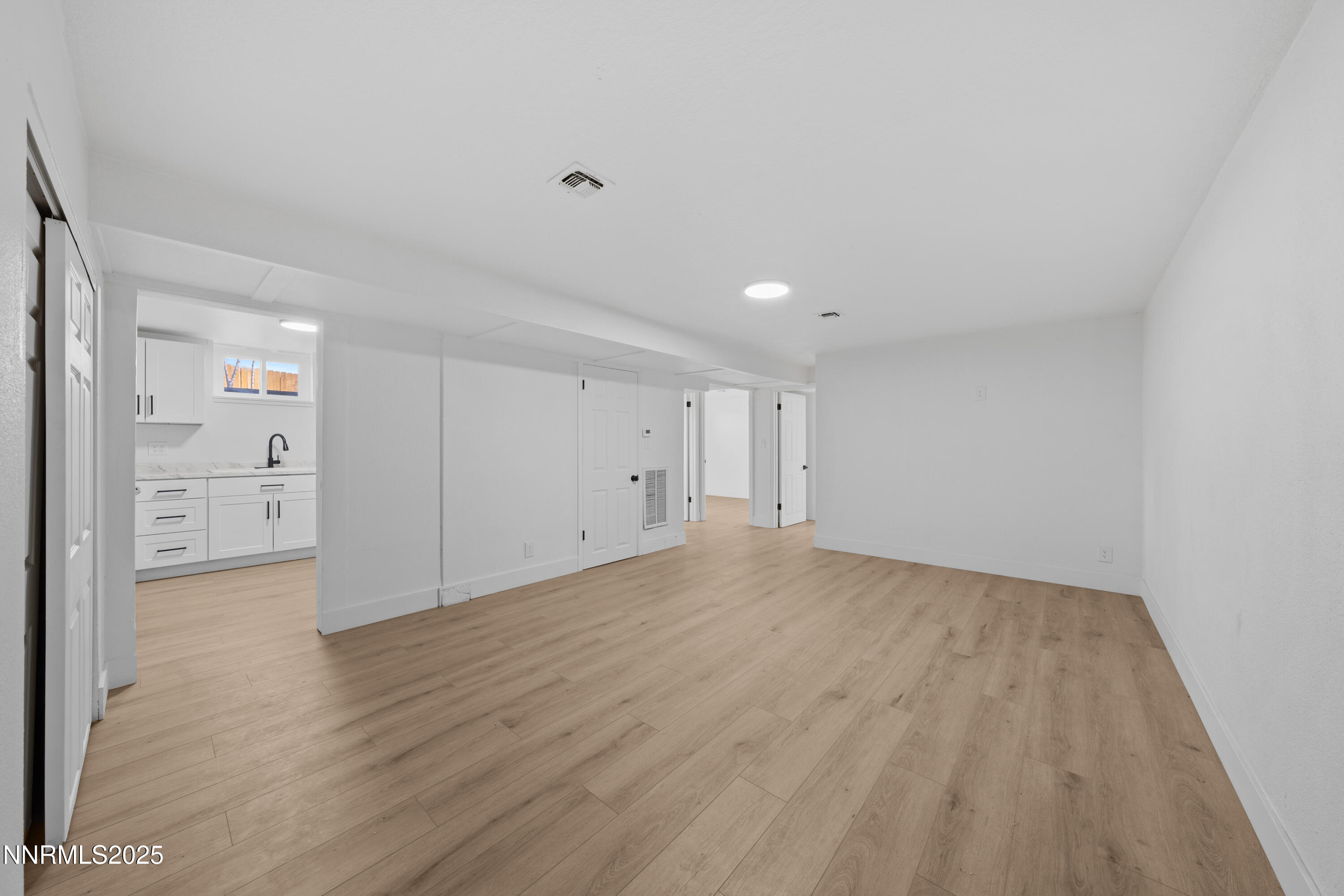 1620 Harold Drive Reno, NV 89503 - Photo 28 of 49 a view of empty room with wooden floor