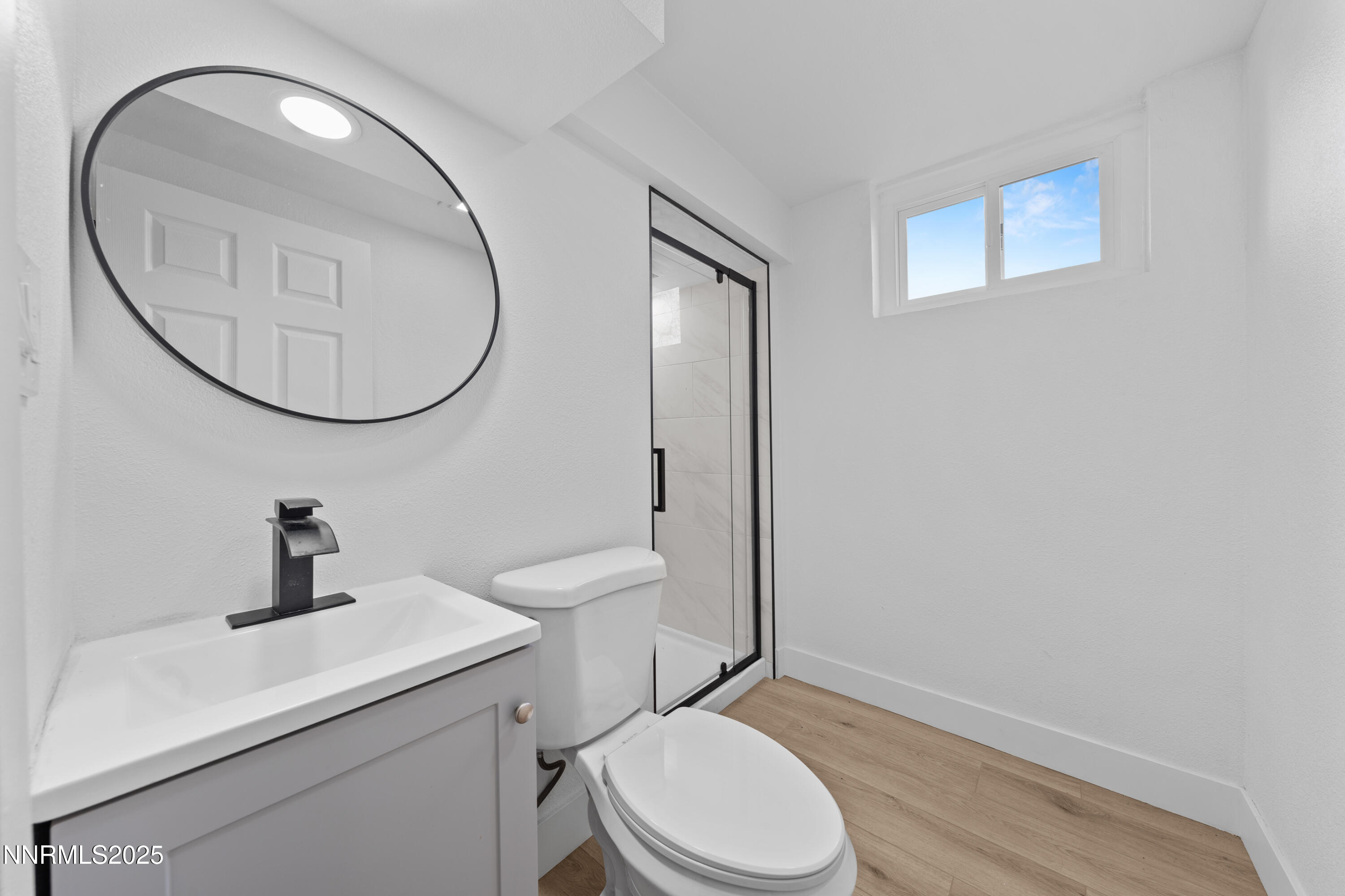 1620 Harold Drive Reno, NV 89503 - Photo 35 of 49 a bathroom with a toilet a sink and mirror