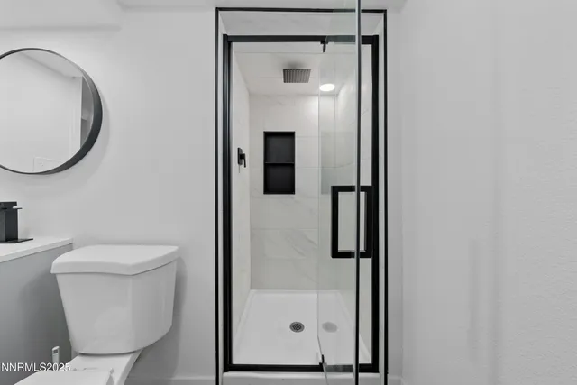 a bathroom with a toilet and a sink