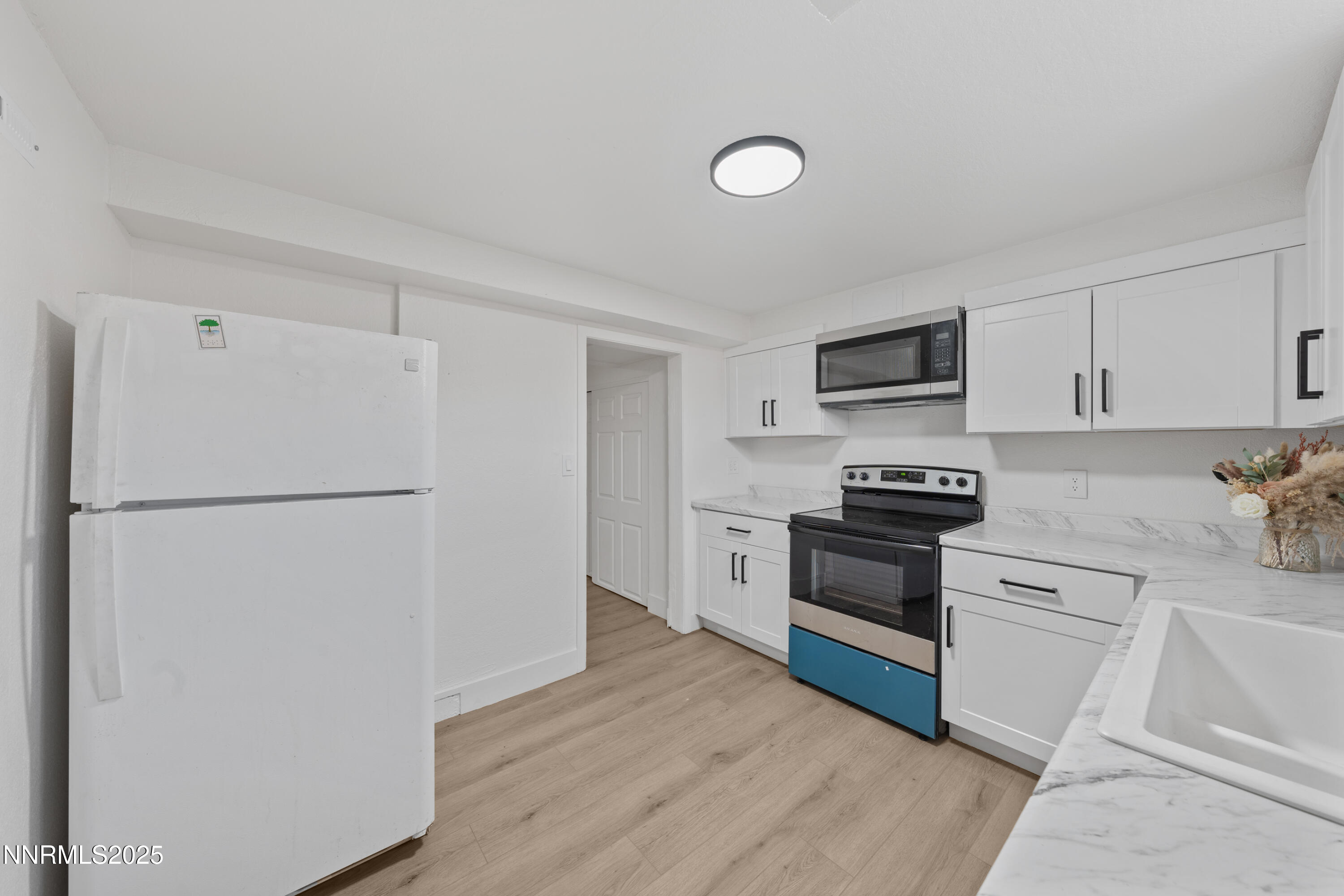 1620 Harold Drive Reno, NV 89503 - Photo 40 of 49 a kitchen with a refrigerator sink and stove top oven