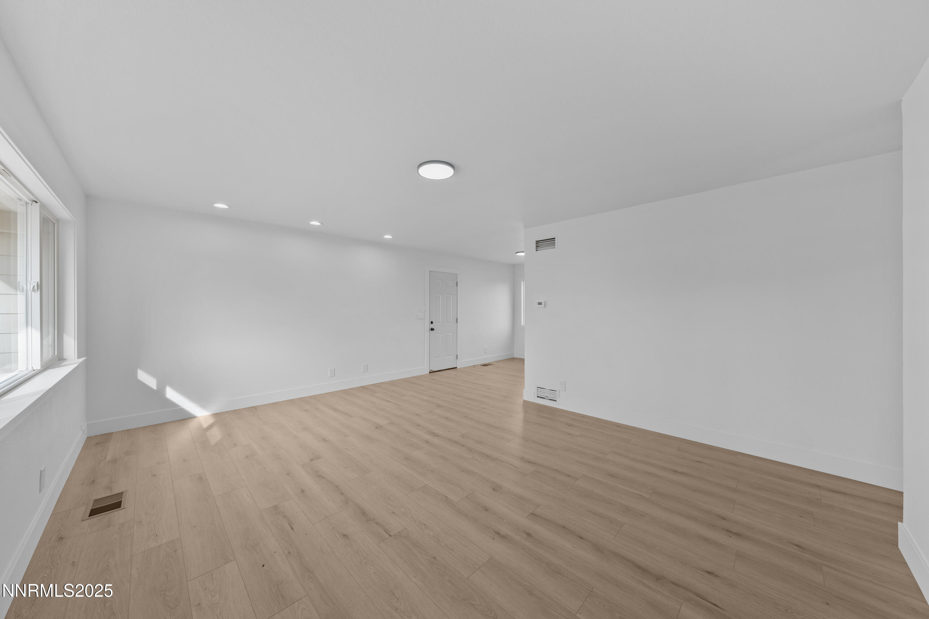 1620 Harold Drive Reno, NV 89503 - Photo 4 of 49 a view of an empty room with wooden floor and a window
