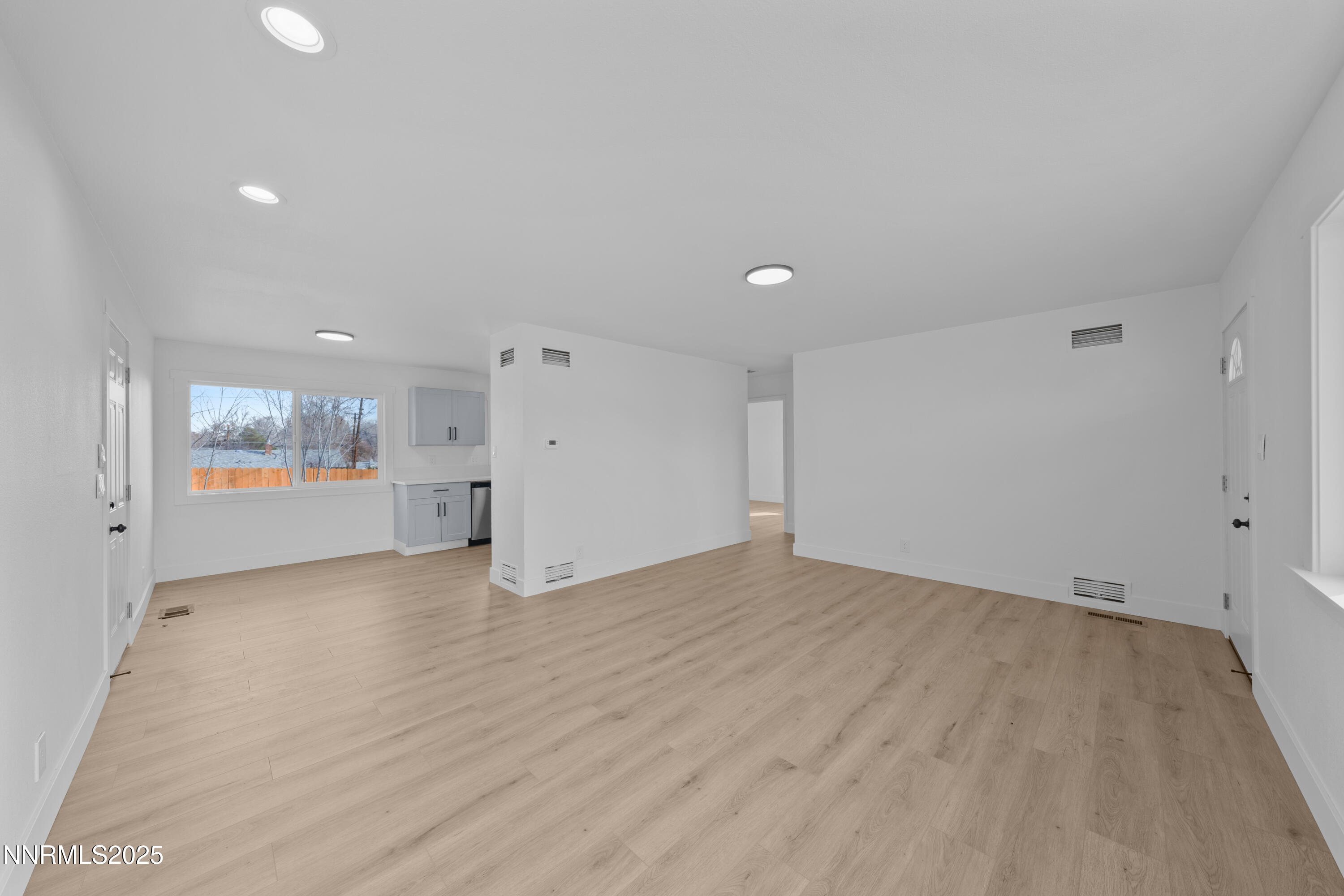 1620 Harold Drive Reno, NV 89503 - Photo 5 of 49 a view of an empty room with wooden floor and a window