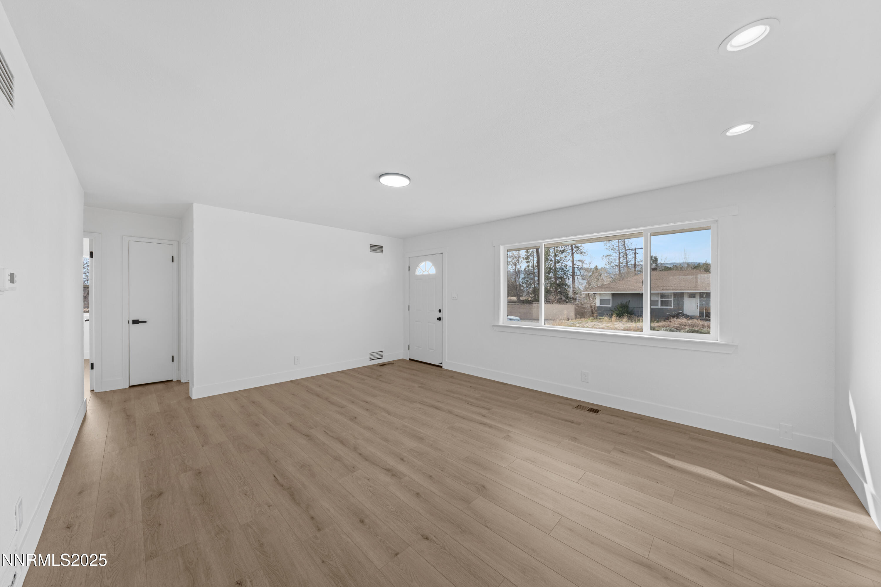1620 Harold Drive Reno, NV 89503 - Photo 6 of 49 wooden floor in an empty room with a window