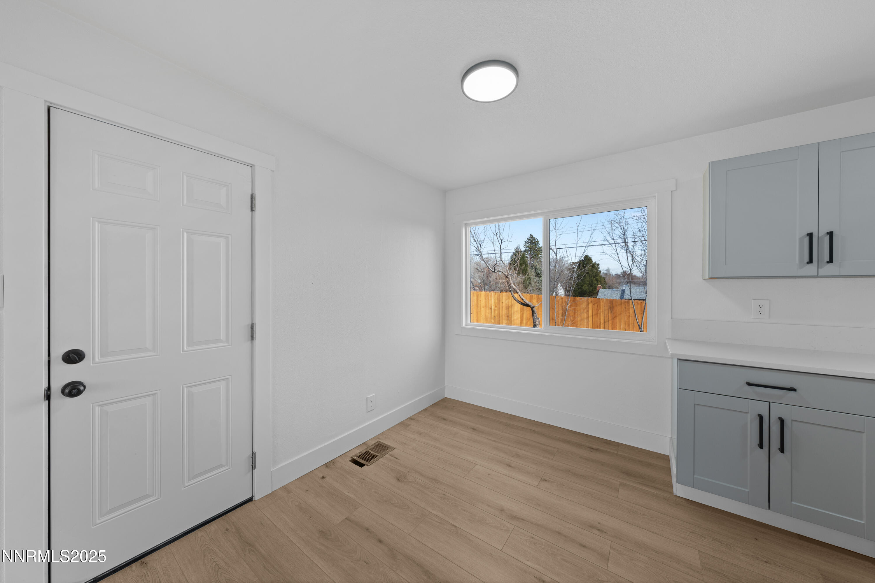 1620 Harold Drive Reno, NV 89503 - Photo 8 of 49 a view of an empty room with window and wooden floor