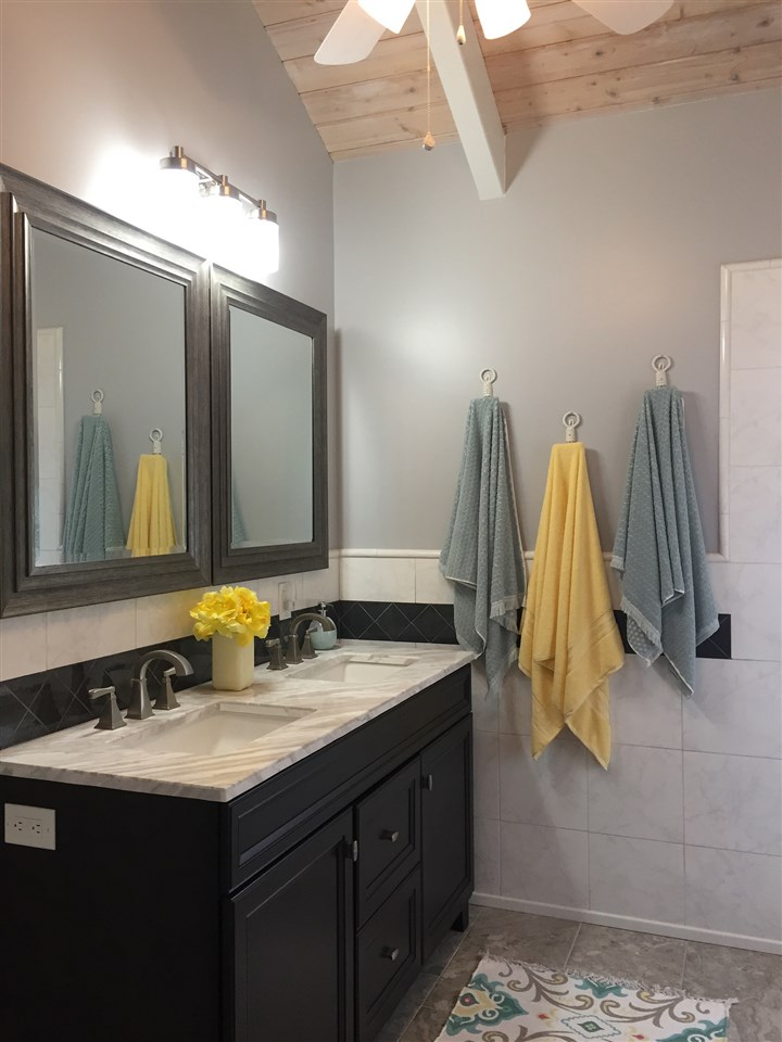 300 Hanauana Road Haiku, HI 96708 - Photo 11 of 30 a bathroom with a sink and a mirror