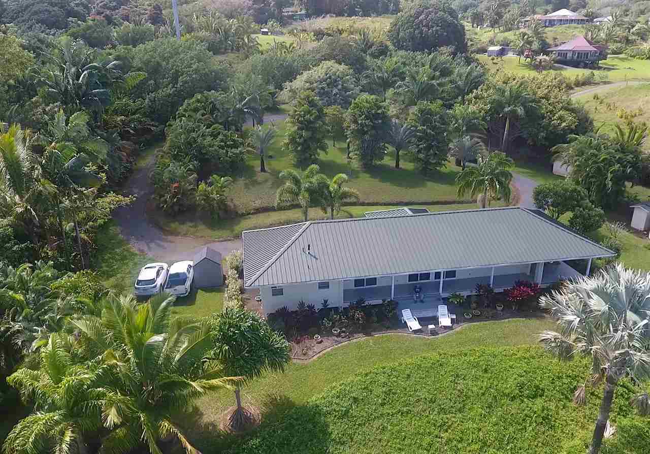 300 Hanauana Road Haiku, HI 96708 - Photo 15 of 30 an aerial view of a house with swimming pool and a yard