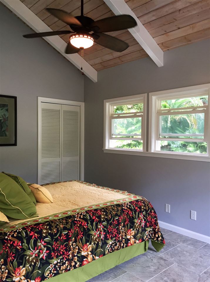 300 Hanauana Road Haiku, HI 96708 - Photo 20 of 30 a bedroom with a bed and a window