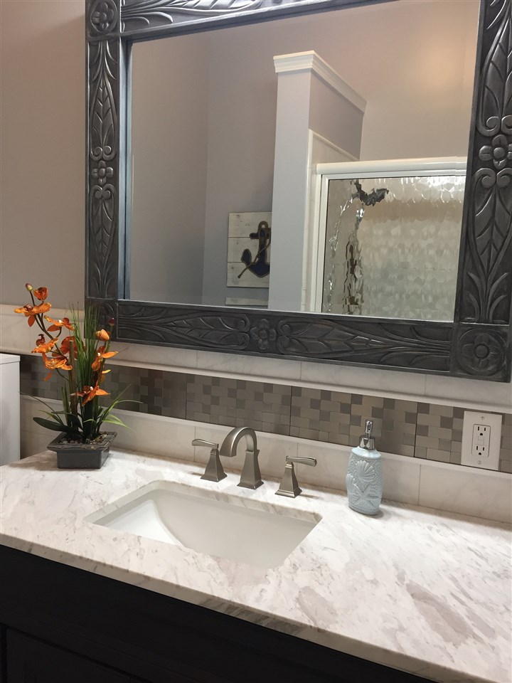300 Hanauana Road Haiku, HI 96708 - Photo 21 of 30 a bathroom with a granite countertop sink and a mirror