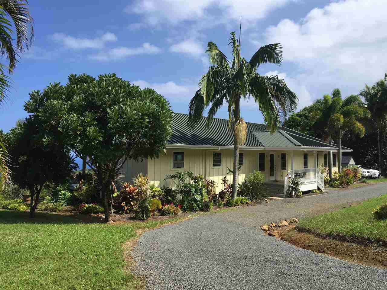 300 Hanauana Road Haiku, HI 96708 - Photo 28 of 30 front view of a house with a yard and potted plants