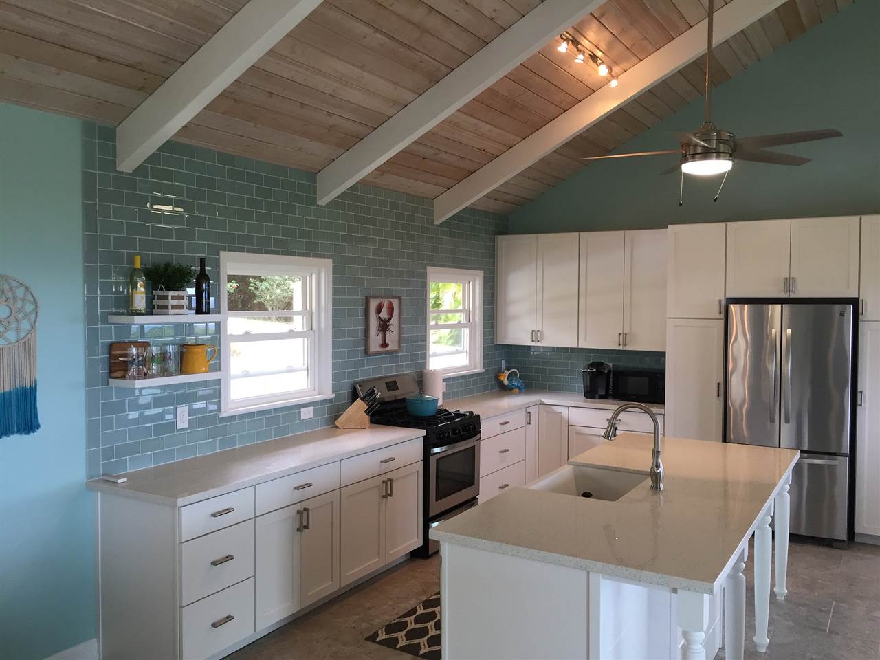 300 Hanauana Road Haiku, HI 96708 - Photo 5 of 30 a kitchen with stainless steel appliances granite countertop a sink a stove and a refrigerator