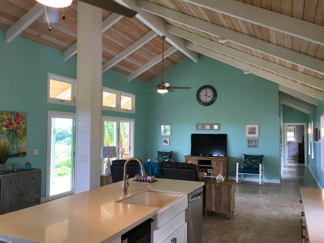 300 Hanauana Road Haiku, HI 96708 - Photo 8 of 30 a kitchen with stainless steel appliances a table and chairs in it