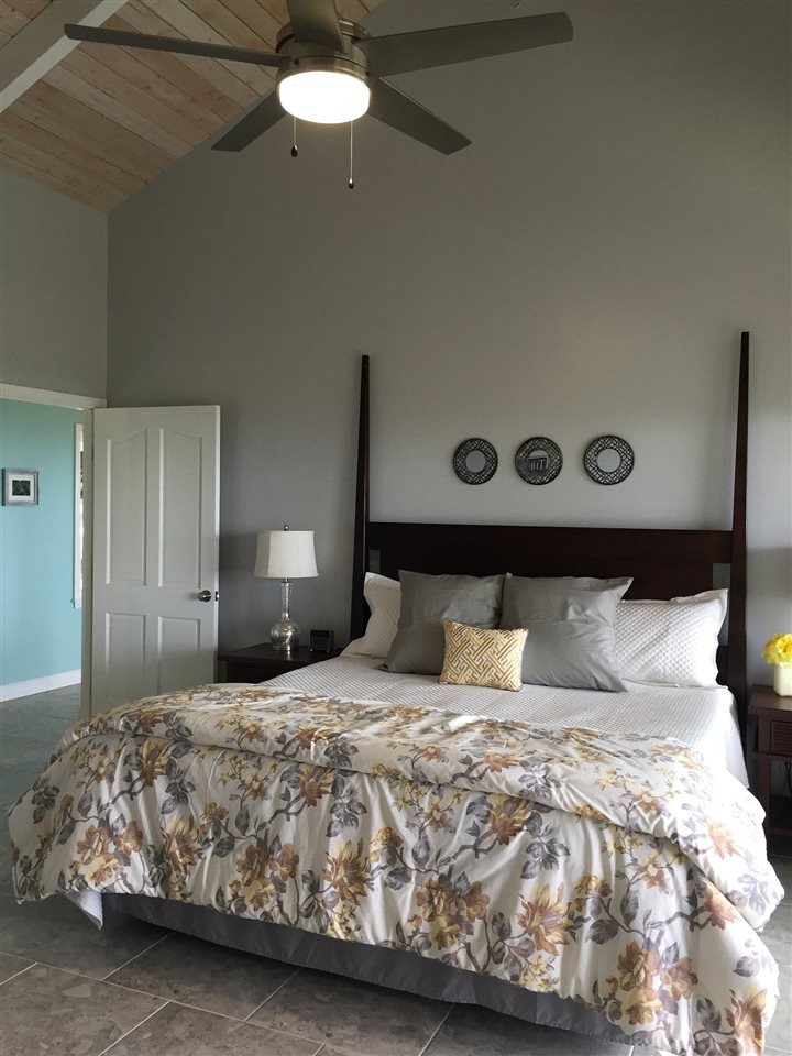 300 Hanauana Road Haiku, HI 96708 - Photo 9 of 30 a bedroom with a bed and a table