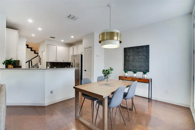 an open kitchen with a table and chairs