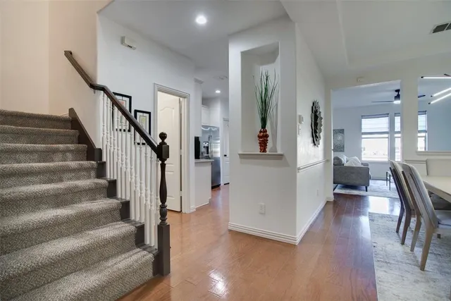 a view of entryway and hall with wooden floor