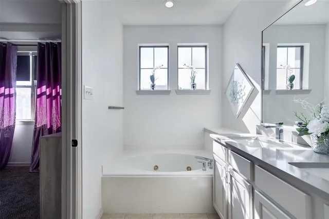 a living room with furniture and a ceiling fan