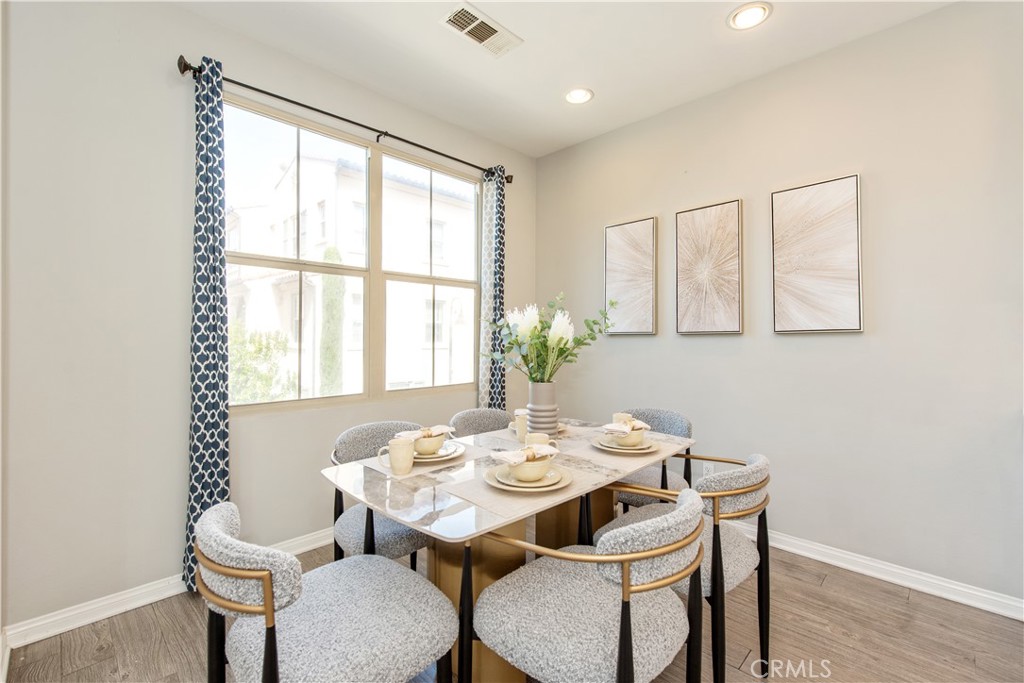 68 Origin Irvine, CA 92618 - Photo 15 of 43 a dining room with furniture and window