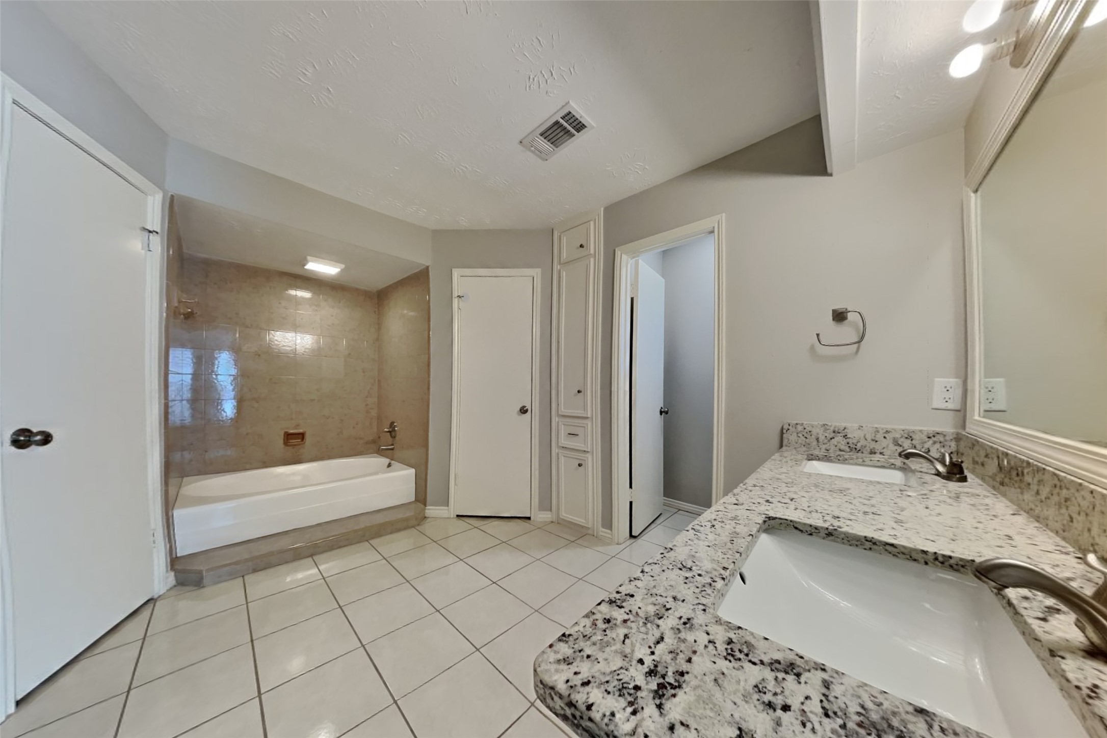 19022 White Candle Drive Spring, TX 77388 - Photo 11 of 22 a bathroom with a tub sink and a mirror