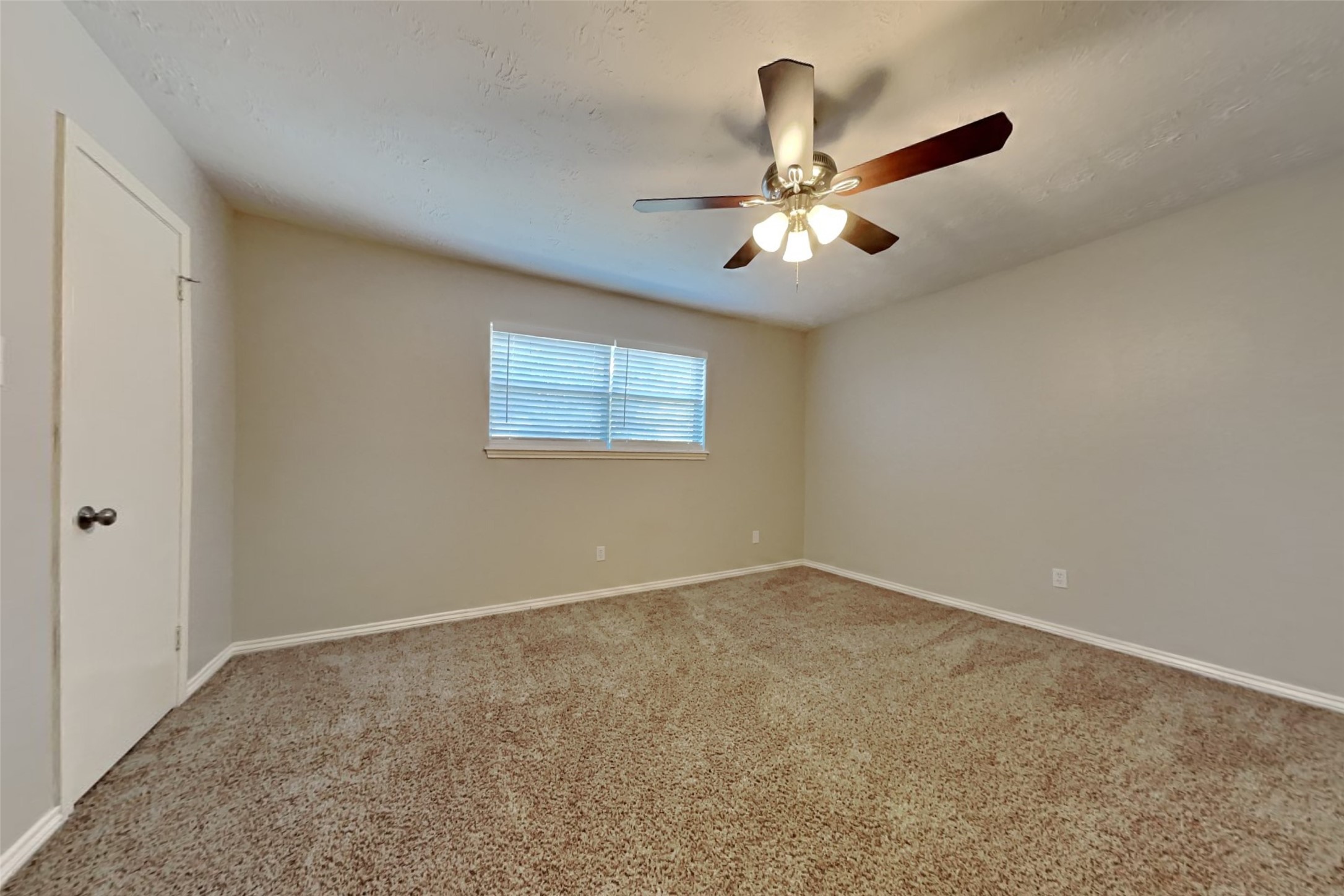 19022 White Candle Drive Spring, TX 77388 - Photo 13 of 22 a view of an empty room with a ceiling fan